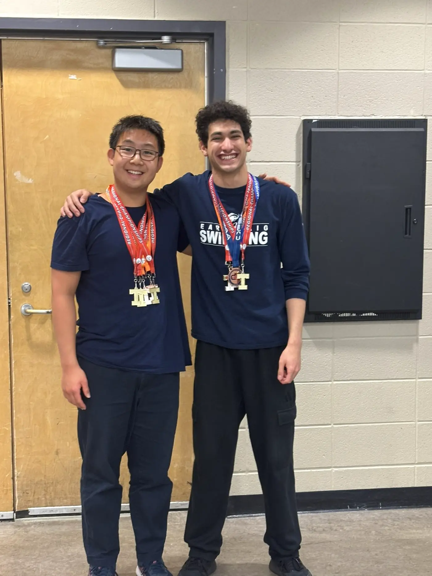 Daniel and a friend after a swimming competition